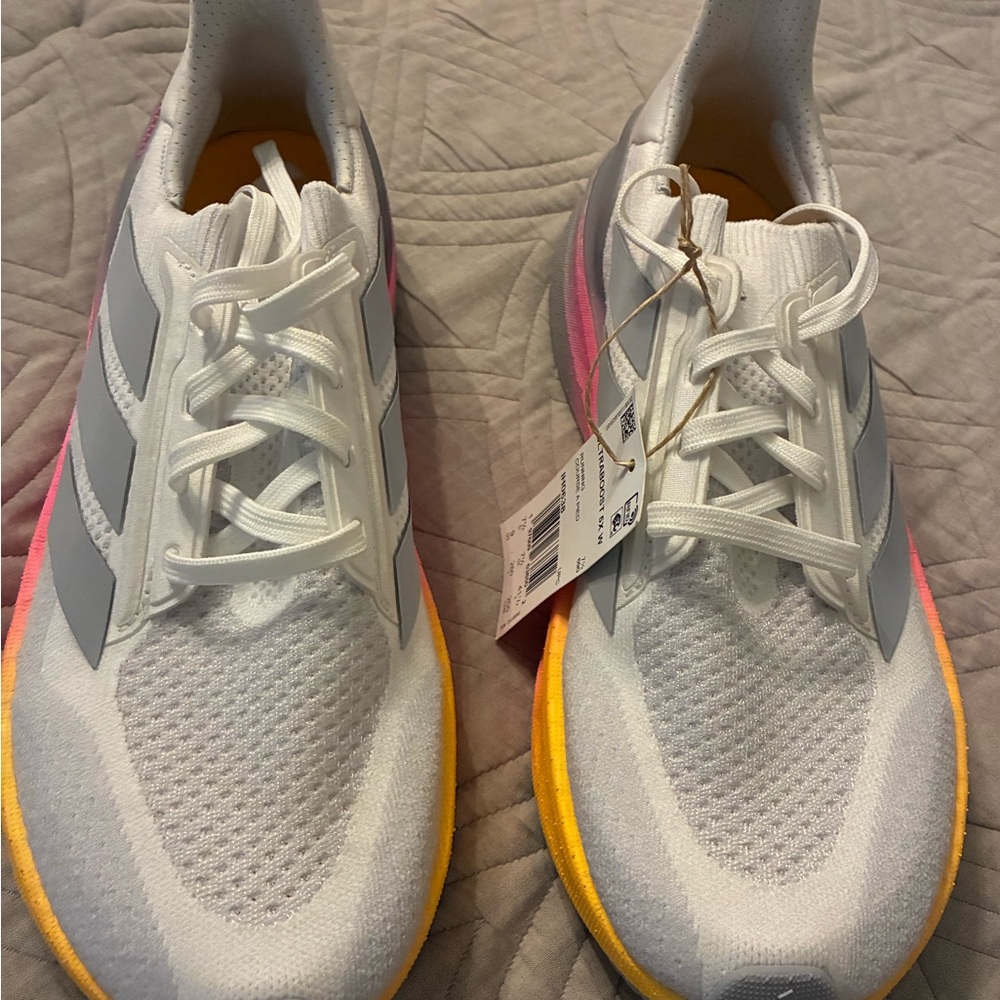 Adidas White Sneakers with Gray Stripes and Pink Highlights